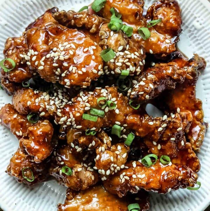 Closeup of Chinese sesame chicken on a white plate