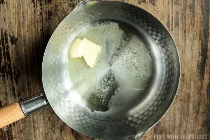 Small pot with melted butter and oil