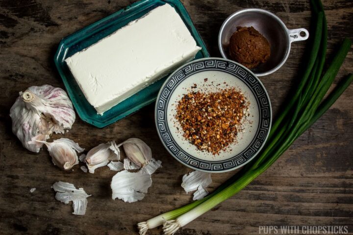 Ingredients for cheese ball (cream cheese, garlic, green onions, miso, togarashi spice)