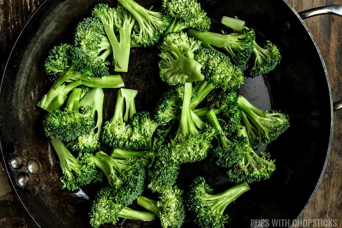 Steam broccoli in a pan.