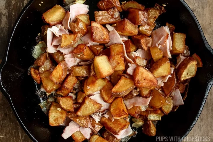Skillet potatoes with onions in a cast iron pan