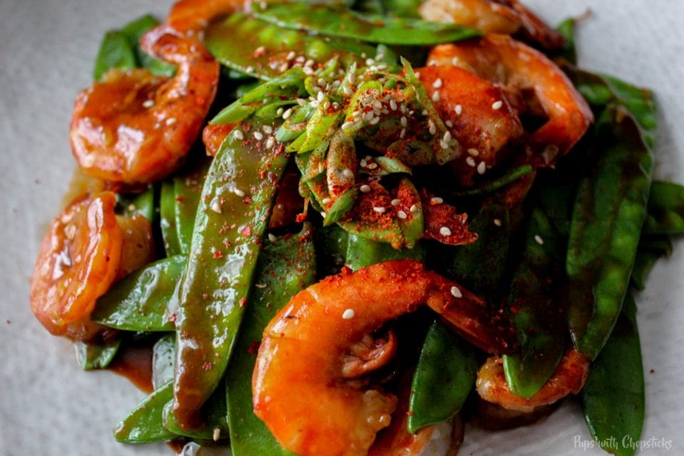 A close up of Spicy Garlic Shrimp with Snow Peas on a plate