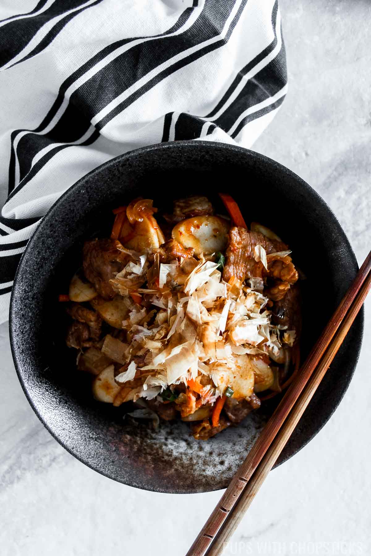 Stir-Fried Kimchi Rice Cakes in a bowl on a table