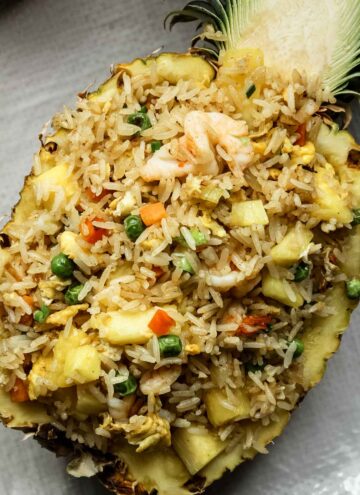 Thai pineapple fried rice in a pineapple bowl.