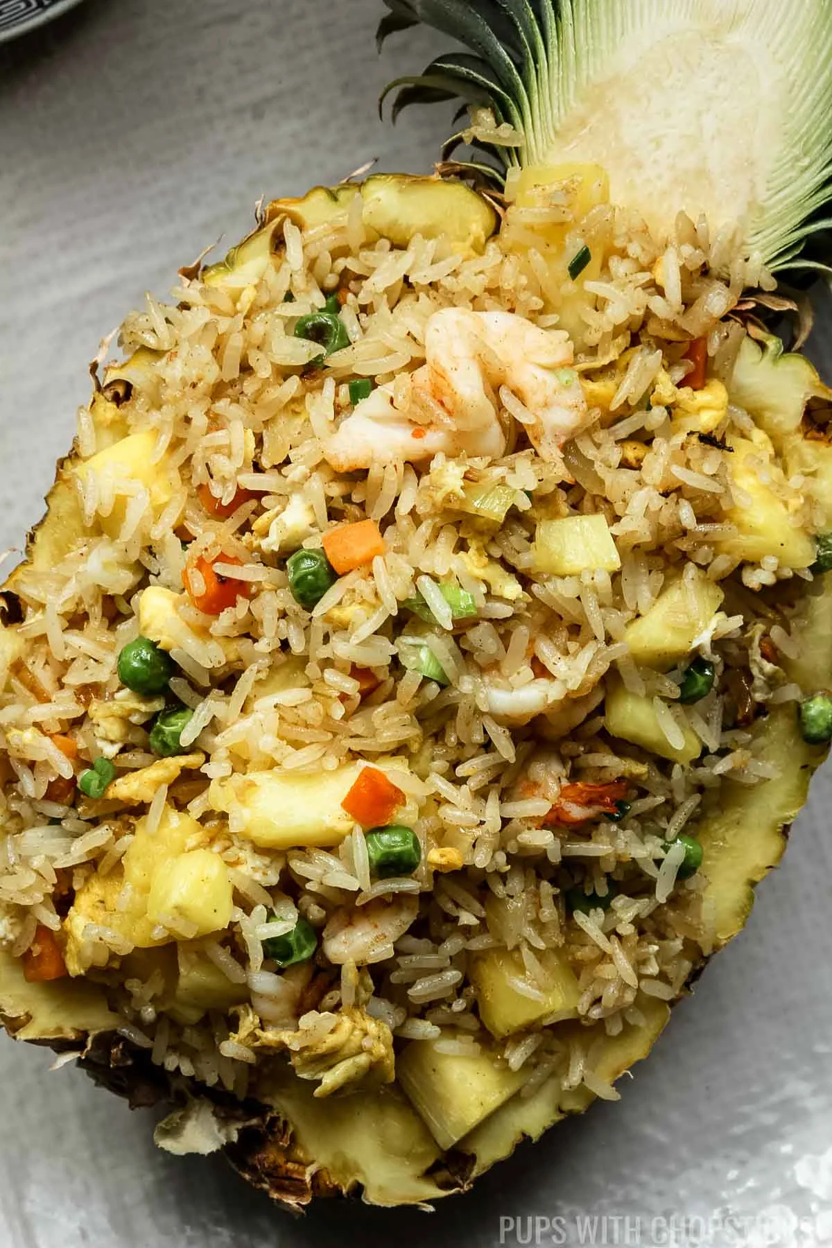 Thai pineapple fried rice in a pineapple bowl.