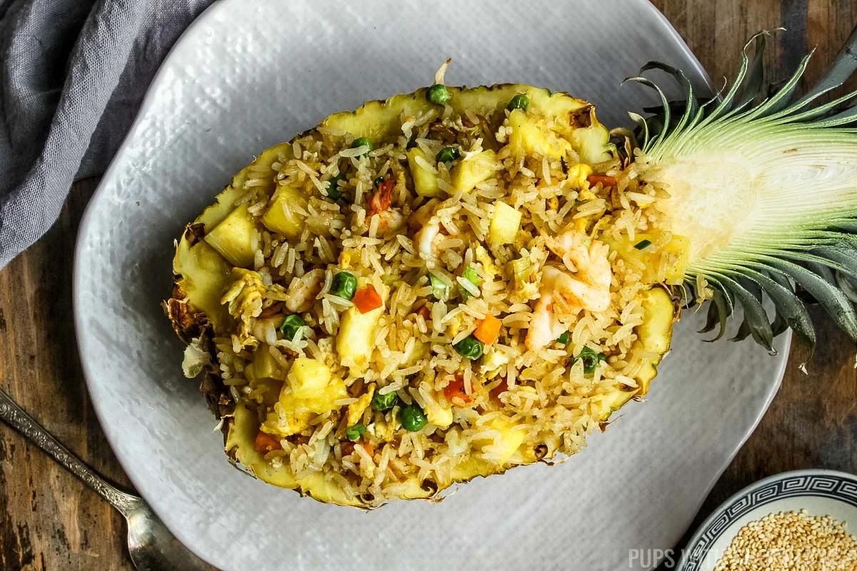 landscape photo of thai pineapple fried rice in bowl.