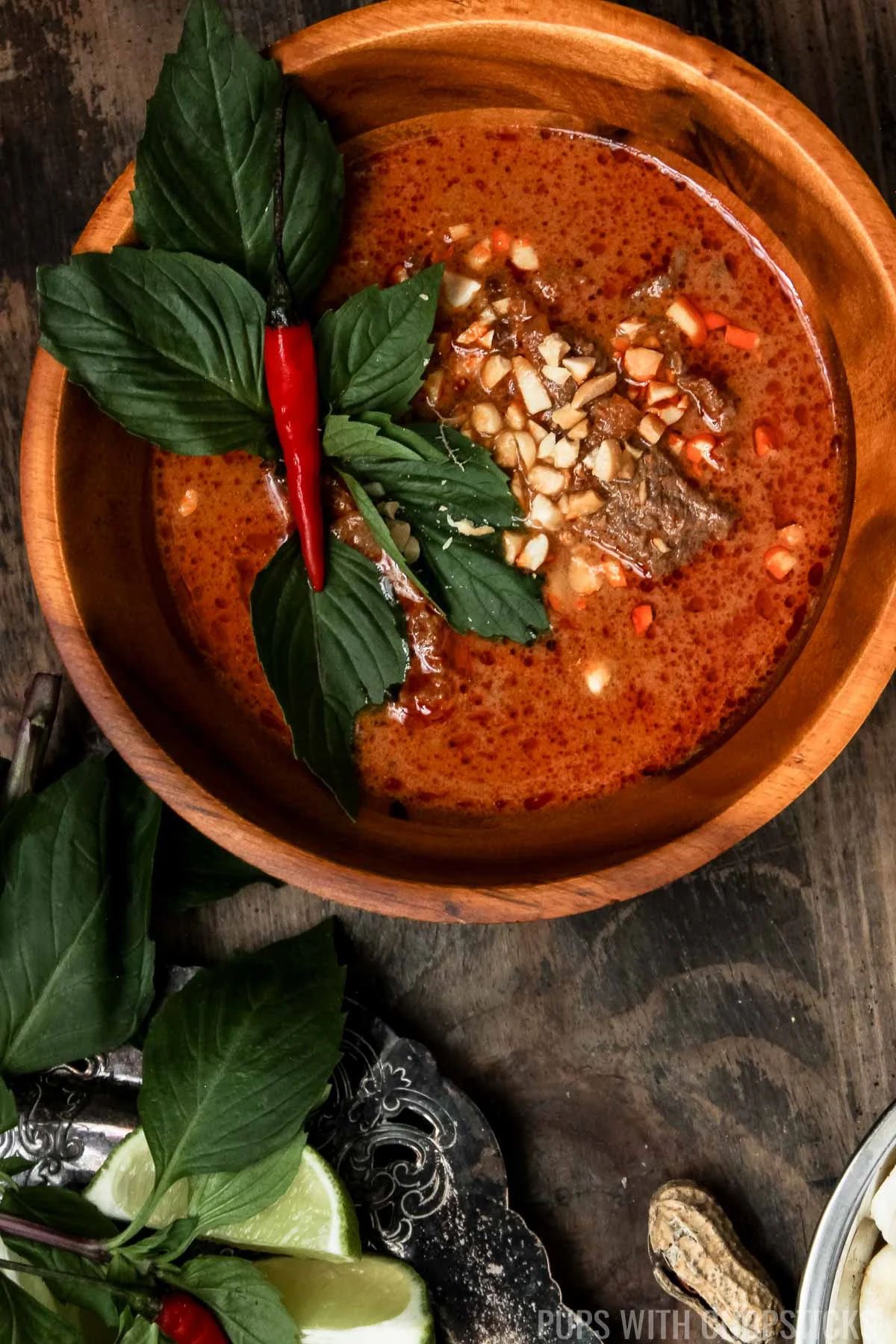 Closeup of Thai Red Curry served with a basil leaf on top