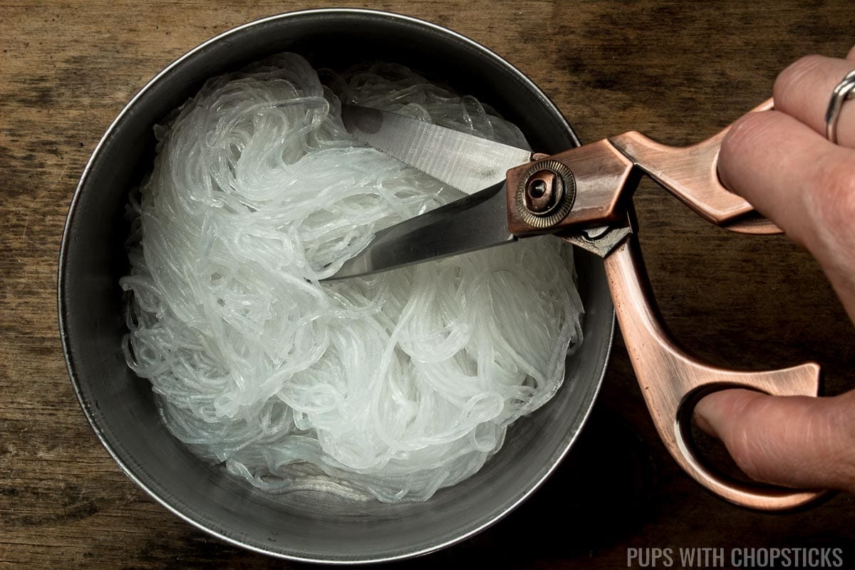 Cutting glass noodles with scissors